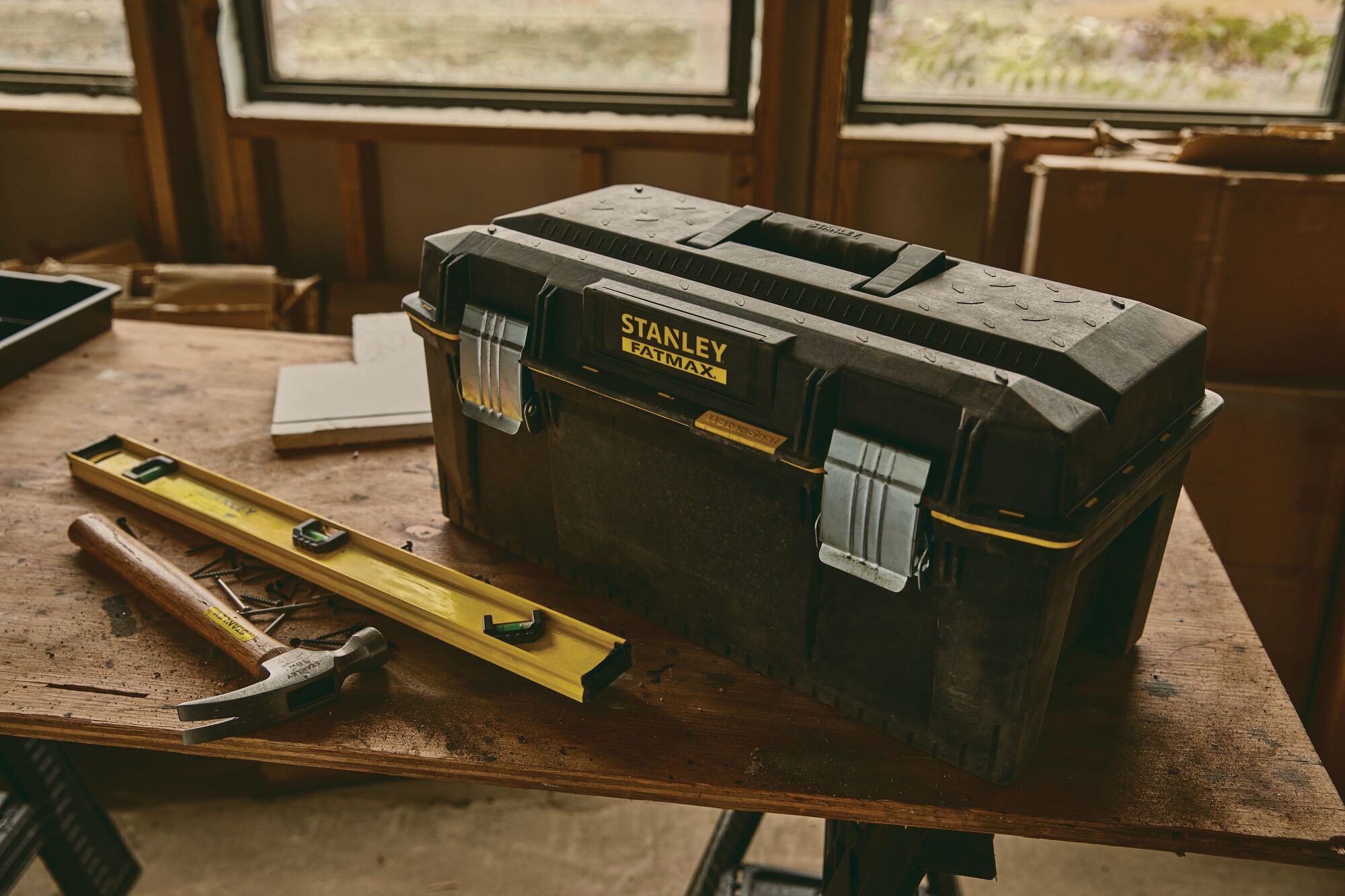 24 inch Series 2000 Tool Box with Tray placed on work table along with other tools.