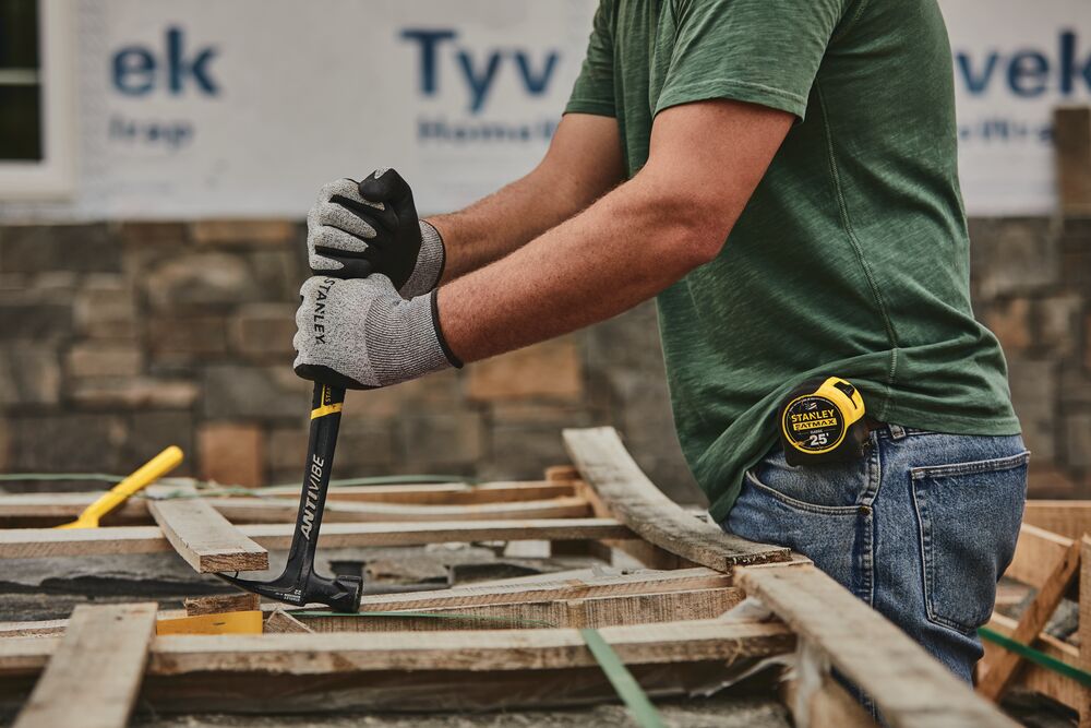 22 ounces rip claw framing hammer being used to pull out nails.